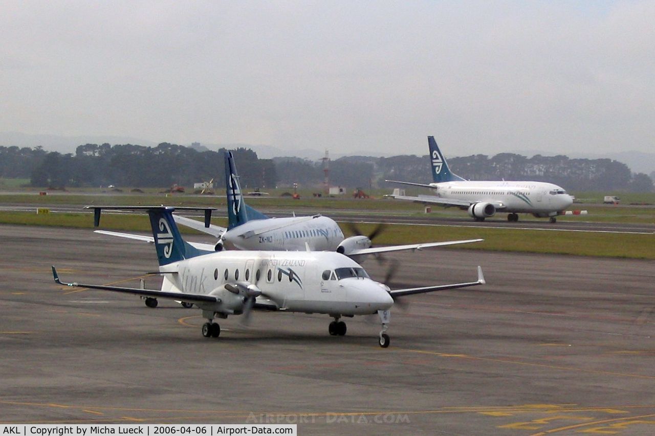 Auckland International Airport, Auckland New Zealand (AKL) - Busy scene at Auckland, with Air NZ's Beech 1900D, Saab 340, and B 737-300