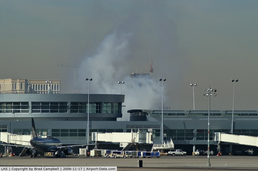 Mc Carran International Airport (LAS) - A better shot of the smoke coming from behind the 'D' Gates Terminal.