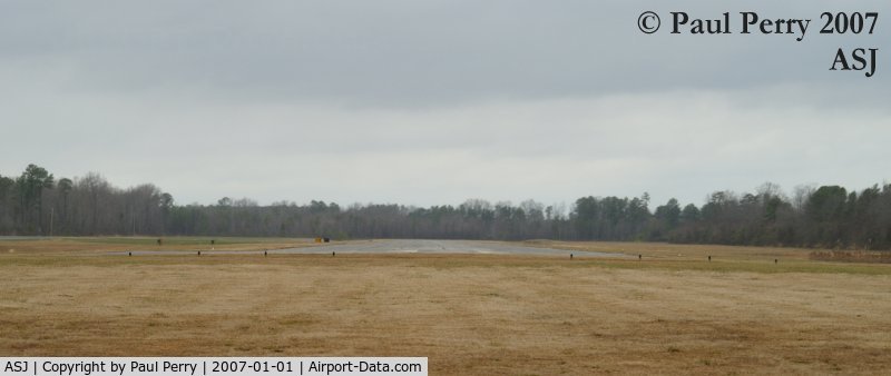 Tri-county Airport (ASJ) - Ground level view down Runway 01