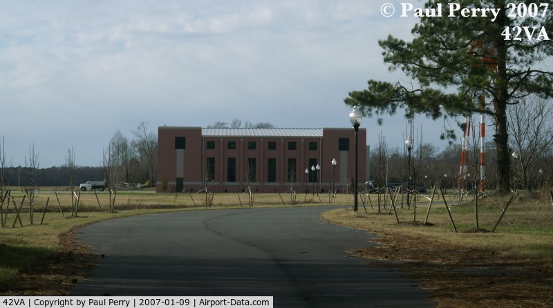 Virginia Beach Airport (42VA) - Inbound road view of one of the hangars, and surrounding grounds