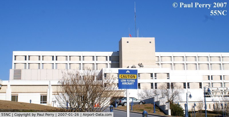 Lenoir Memorial Hospital Heliport (55NC) - The roof mounted windsock, and one of the warning signs at Lenoir Hospital