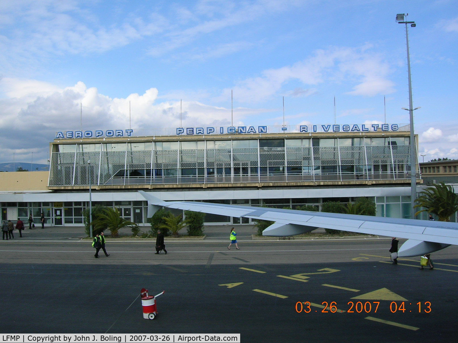 Perpignan Rivesaltes Airport, Perpignan France (LFMP) - Terminal at Perpignan, France. No jet bridge. Stairs and walk across the ramp - rain or shine