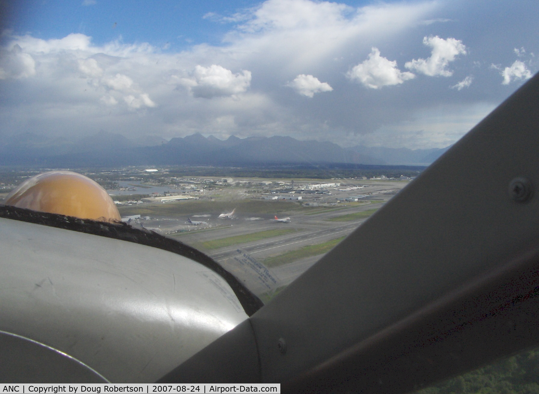 Ted Stevens Anchorage International Airport (ANC) - Ted Stevens Anchorage Int'l Airport, AK. Taken from DHC-2 Beaver float plane N4444Z. Chugach State Park and Mountain Range in distance.