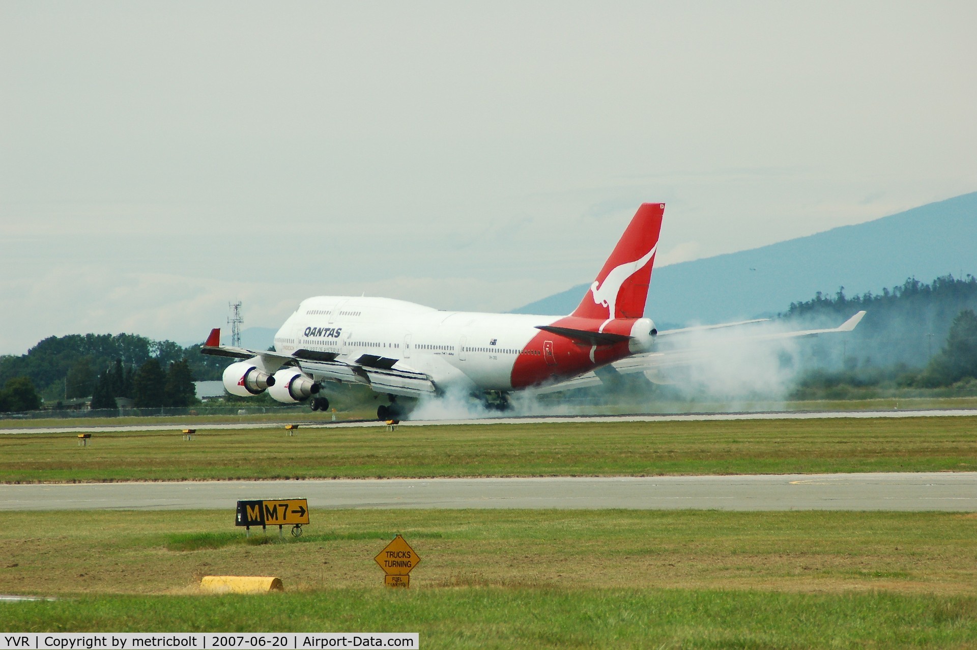 Vancouver International Airport, Vancouver, British Columbia Canada (YVR) - Qantas B747 touch down.Flight from SYD via SFO,summer 2007
