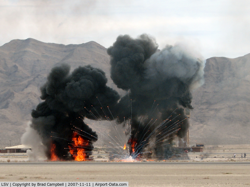Nellis Afb Airport (LSV) - Nellis AFB ATCT with smoke and fire from mock wargames. Aviation Nation 2007
