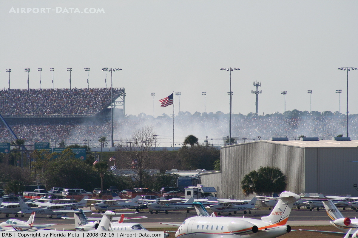 Daytona Beach International Airport (DAB) - Smoke from a crash on the track during Busch Race in background