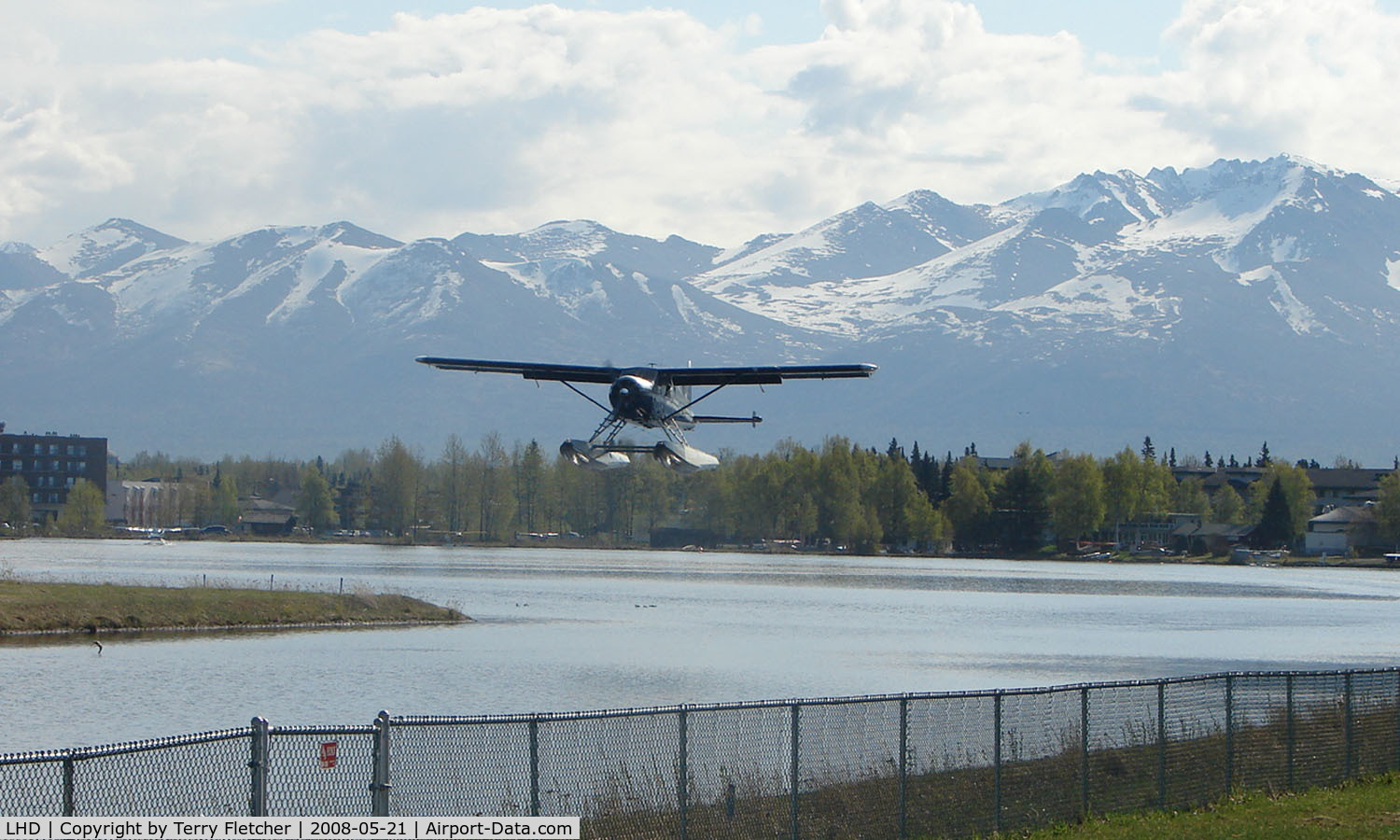 Lake Hood Seaplane Base (LHD) - A DHC2 Beaver takes off from Spenard Lake end against a beautiful backdrop