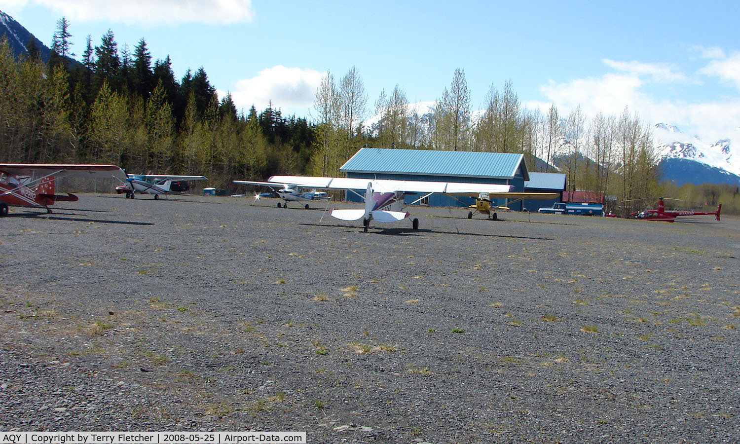 Girdwood Airport (AQY) - Looking on the North parking apron and Alpine Air helicopter facility