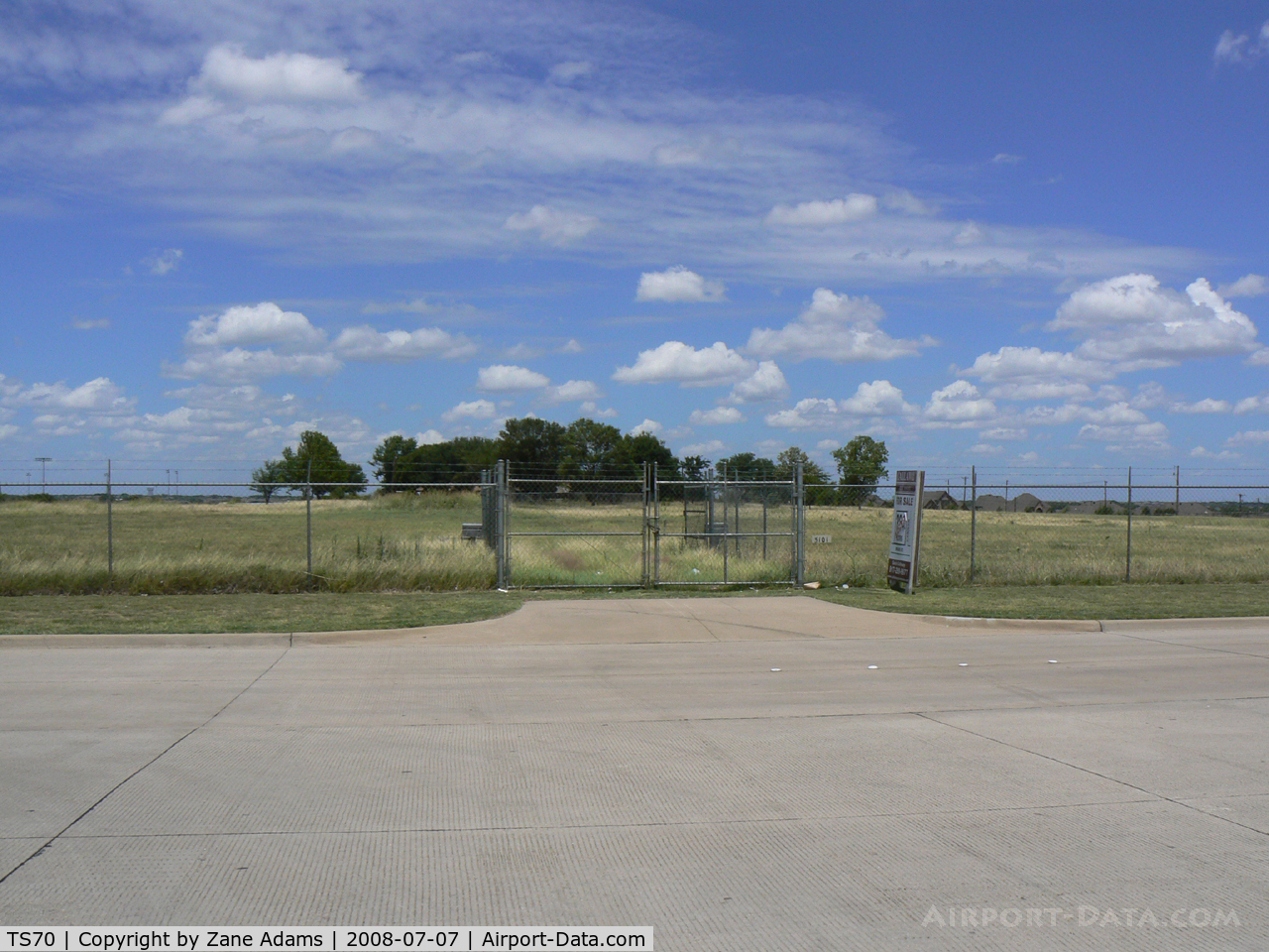 Jack Miller Airport (TS70) - Jack Miller Stolport - Now closed by encroachment and development land fenced and recently sold hanger removed. The only clue as to its former use is a windsock pole. 
