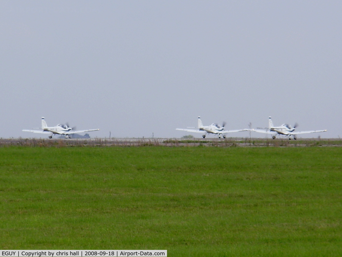 RAF Wyton Airport, St Ives, England United Kingdom (EGUY) - Three GROB G115E's ready for take-off