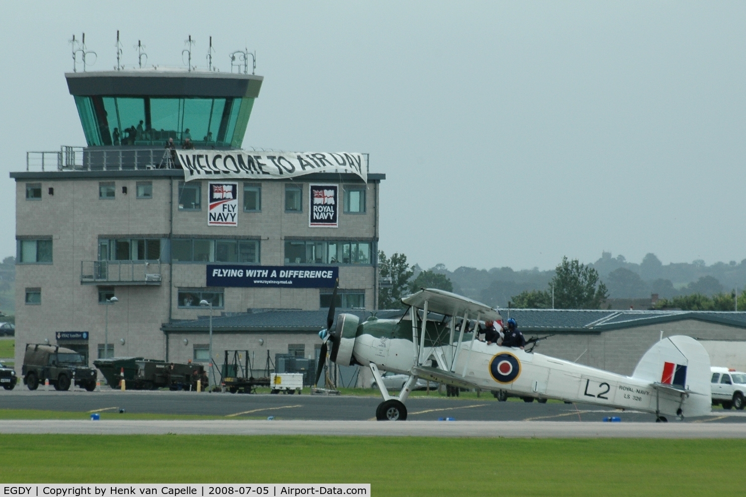 RNAS Yeovilton Airport, Yeovil, England United Kingdom (EGDY) - RNAS Yeovilton at the 2008 Air day: banners on the tower and a Fairey Swordfish in front of it.