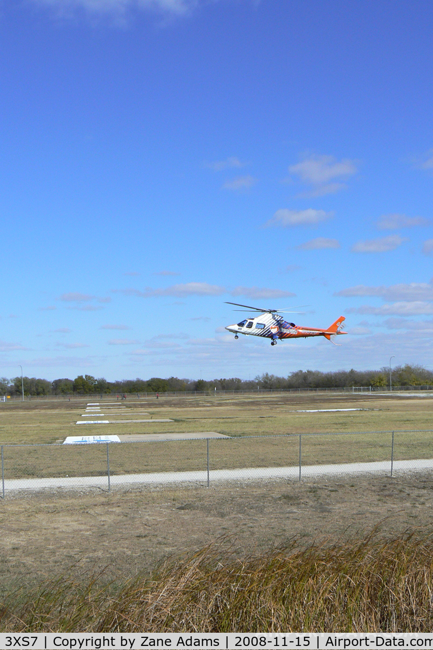 Bell Training Facility Heliport (3XS7) - Texas Motor Speedway Heliport - CareFlite N144CF landing during the Boy Scout Camporee