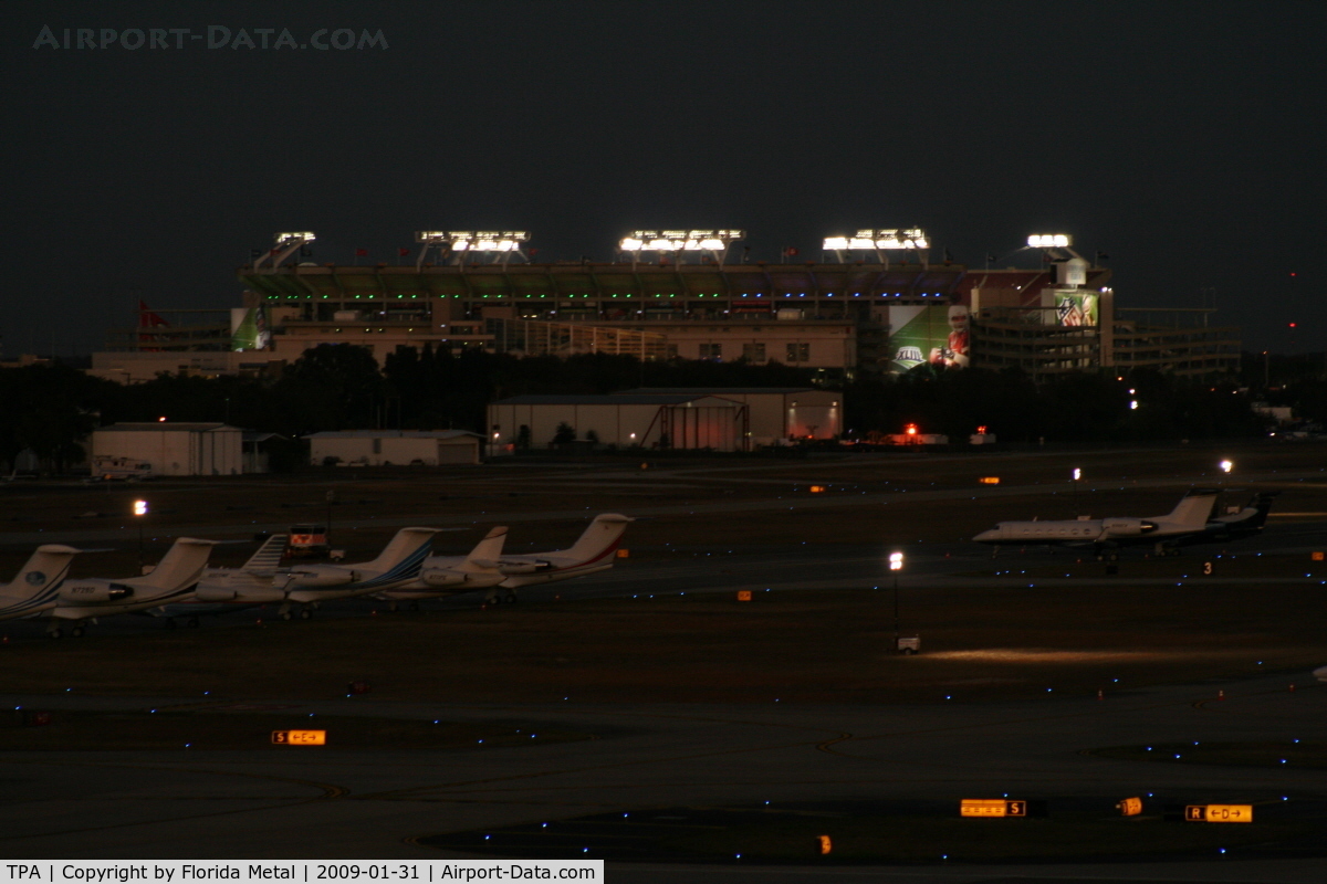 Tampa International Airport (TPA) - Night view of Tampa ramp and Raymond James Stadium