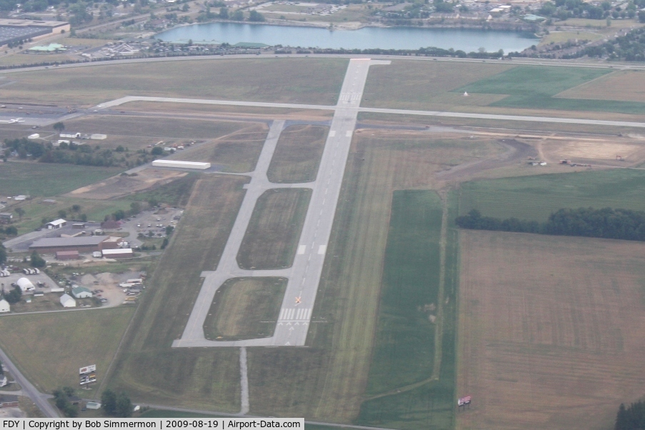 Findlay Airport (FDY) - Looking east at the construction work.  Note the illuminated X on RWY 7