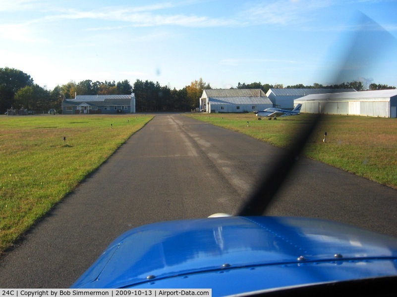 Lowell City Airport (24C) - Looking south on the taxiway.