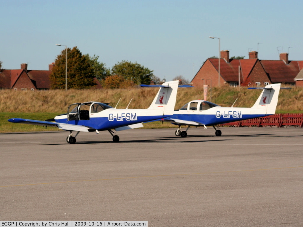 Liverpool John Lennon Airport, Liverpool, England United Kingdom (EGGP) - G-LFSM and G-LFSH Piper PA-38-112 of the Liverpool Flying School