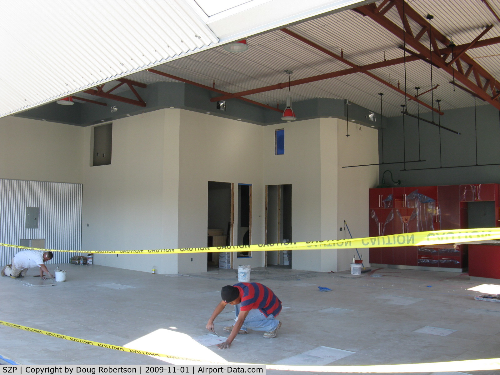 Santa Paula Airport (SZP) - 32 Curtiss Taxi-New hangar under construction. Tile floor installation.