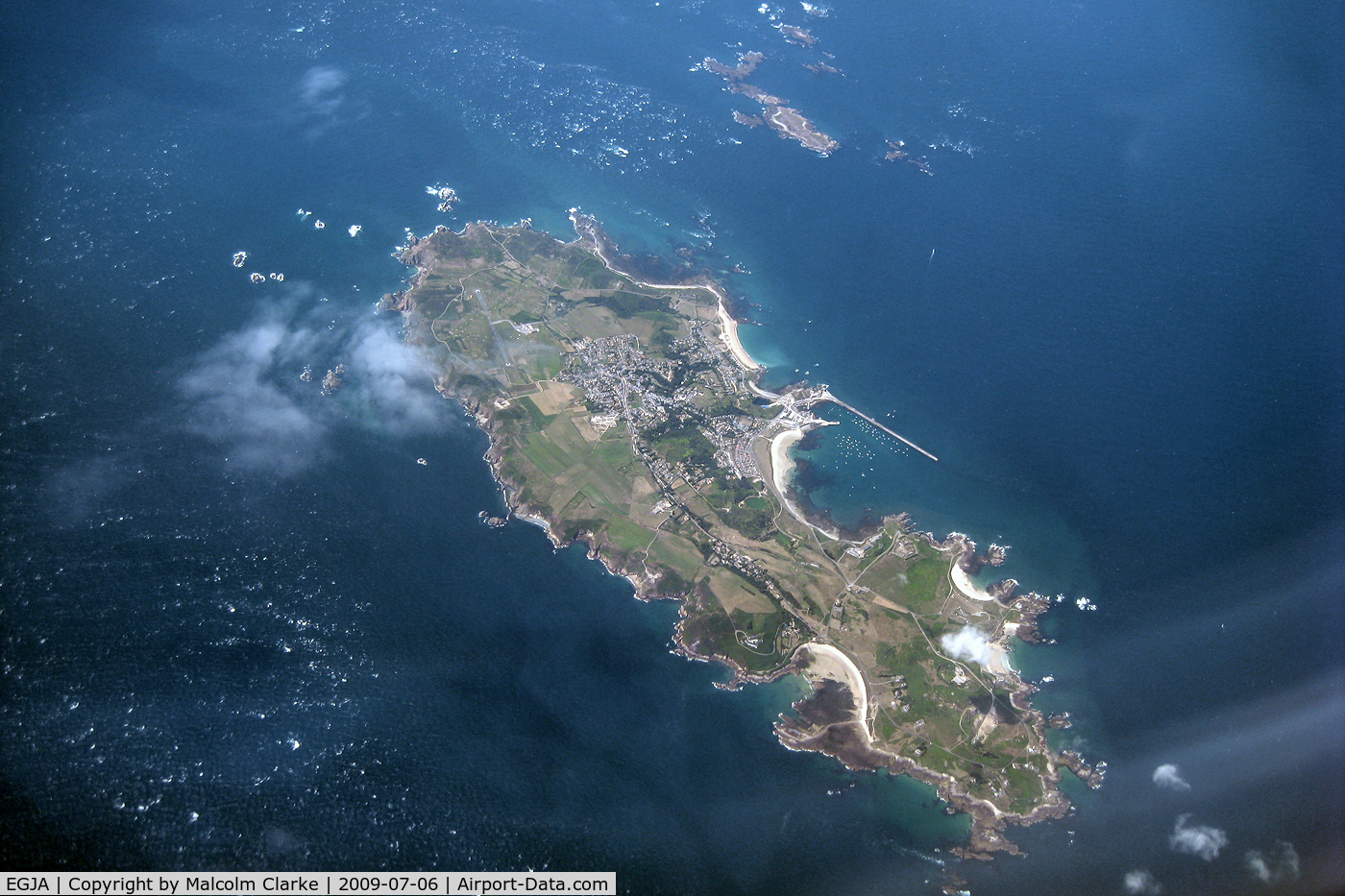 Alderney Airport, Alderney, Channel Islands United Kingdom (EGJA) - Alderney, Channel Islands with the airport seen at the northern end of the island. Taken during a flight from Jersey to Newcastle in 2009.