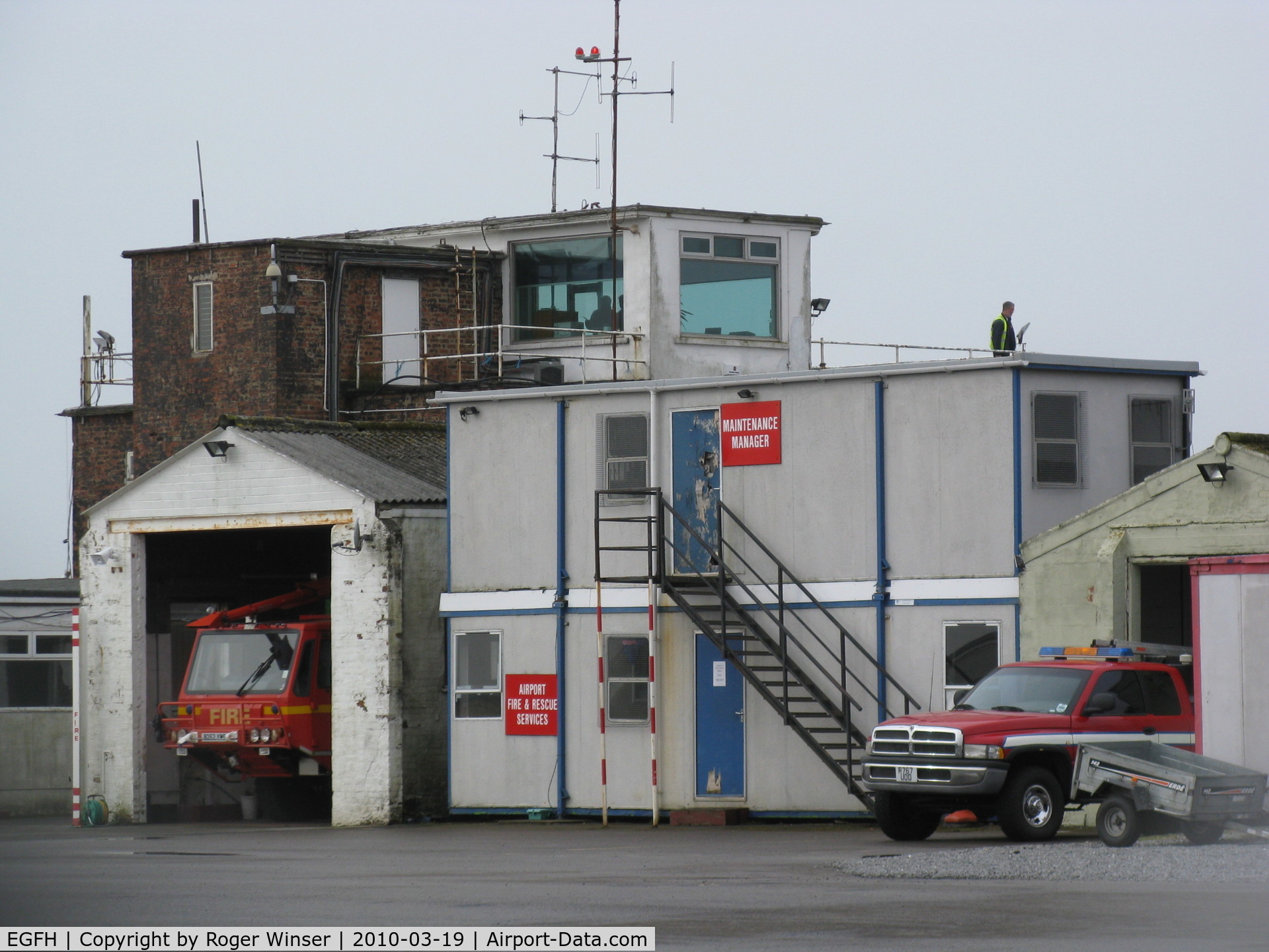 Swansea Airport, Swansea, Wales United Kingdom (EGFH) - 1941 built RAF watch office/control tower, trailer and tractor shed and fire tender shed