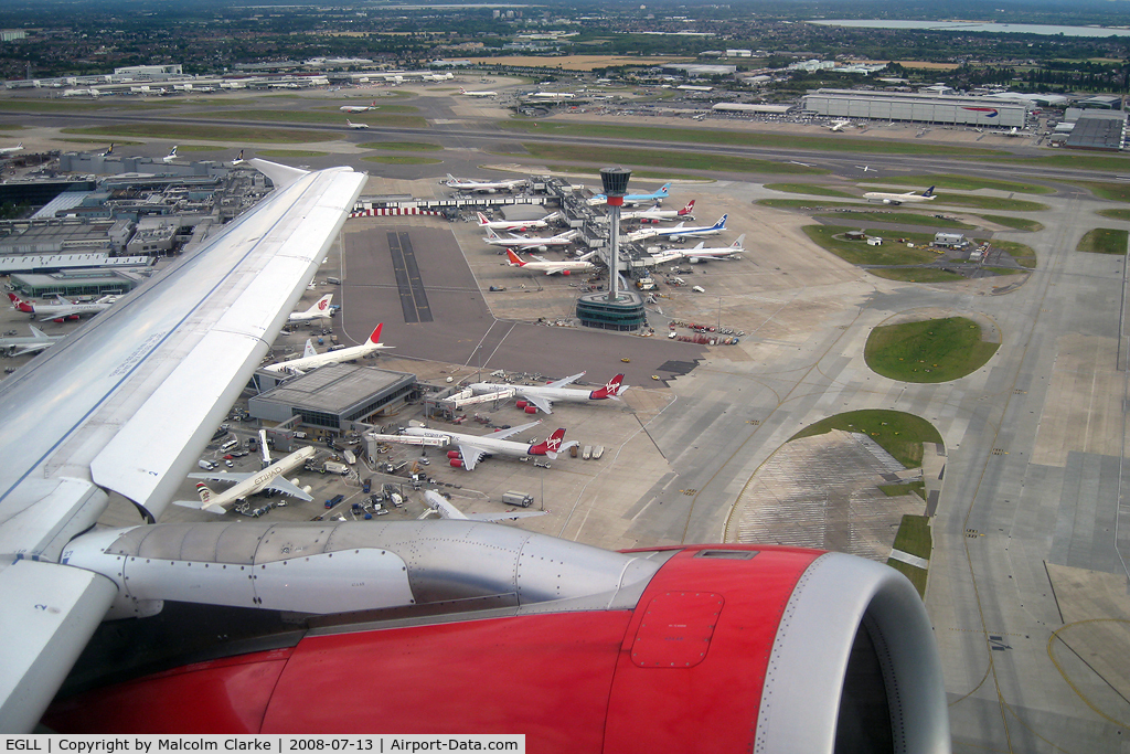 London Heathrow Airport, London, England United Kingdom (EGLL) - Passing Terminal 4 and the new control tower at London Heathrow as seen from Airbus G-DBCG in 2008. 
