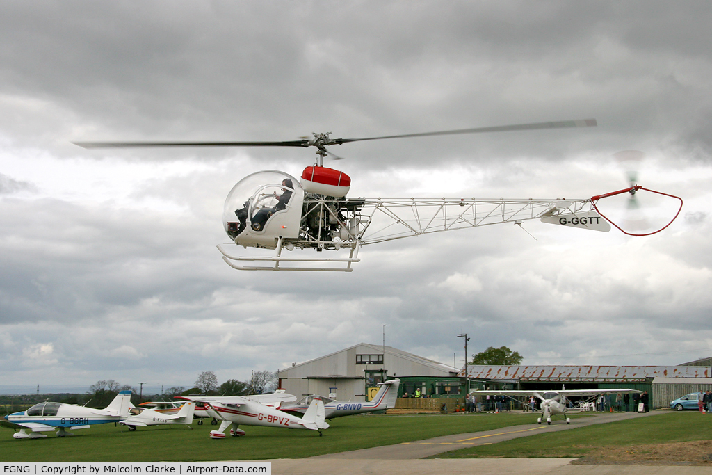 EGNG Airport - A view across Bagby Airfield as Agusta G-GGTT prepares to put down.