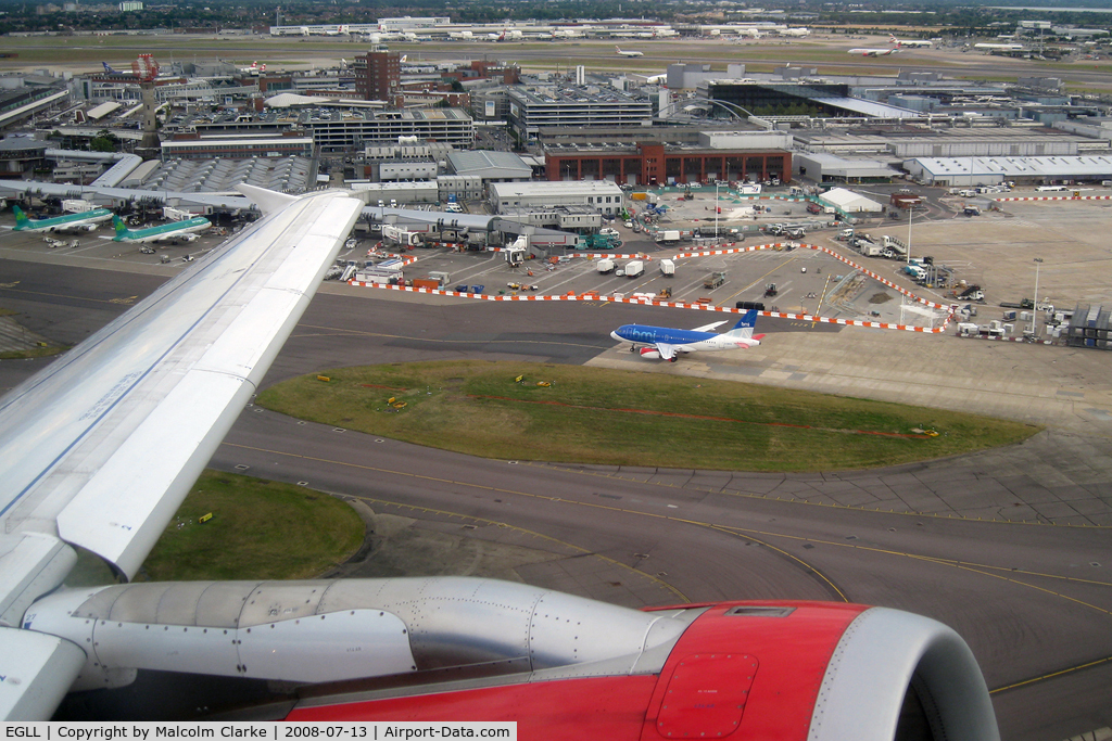 London Heathrow Airport, London, England United Kingdom (EGLL) - A view across Terminals 1, 2 and 3 at London Heathrow as seen from Airbus G-DBCG on take off en route to Newcastle in July 2008.