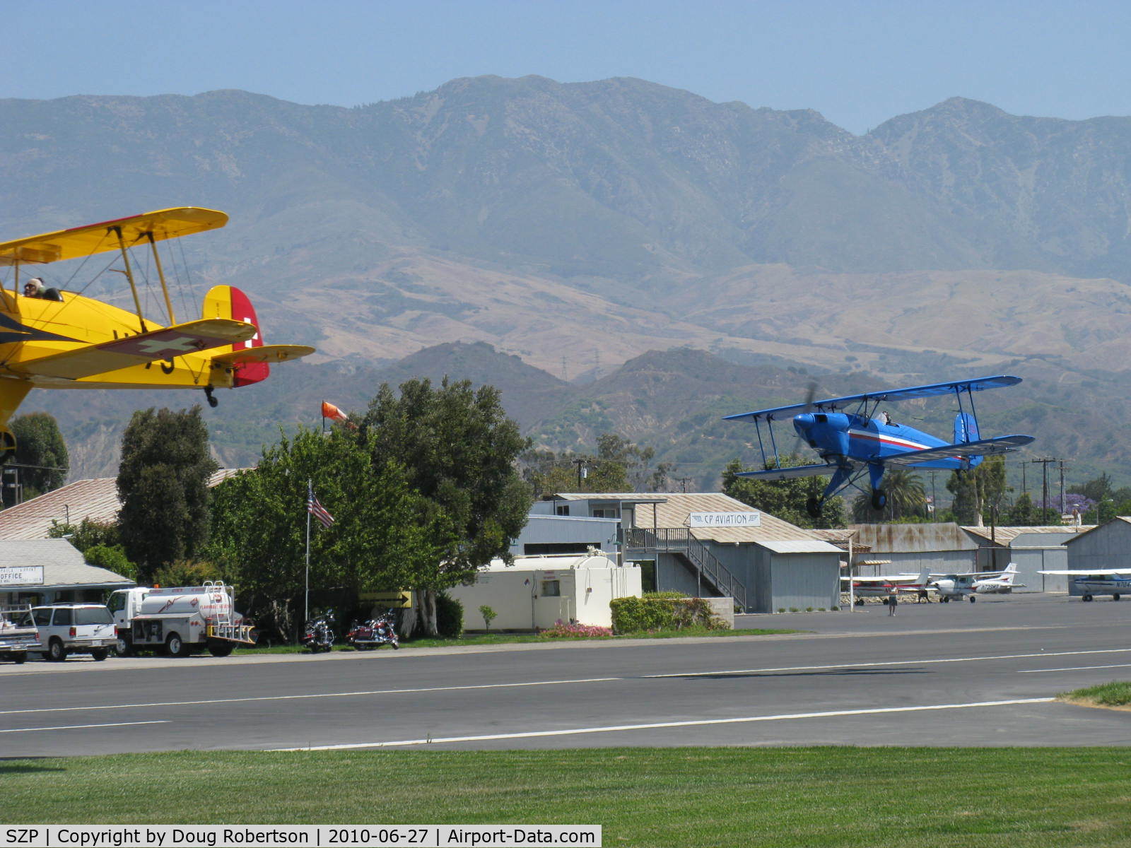 Santa Paula Airport (SZP) - N131MR and N104A in tandem takeoff Rwy 22 at the National Bucker fly-In. (I need a wider angle lens)