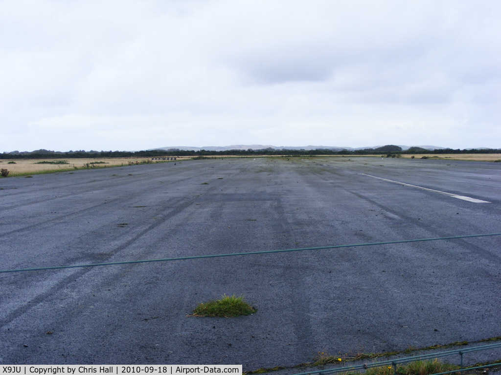 X9JU Airport - a section of R/W 25/07 at Jurby Airfield, IOM. which is bisected by a road