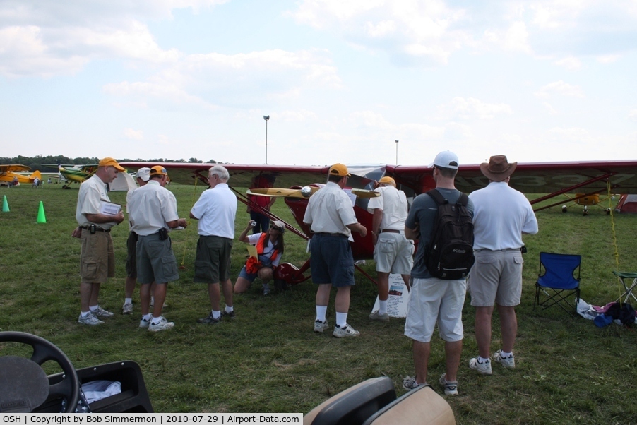 Wittman Regional Airport (OSH) - Judging crew checking out N33708 at Airventure 2010.