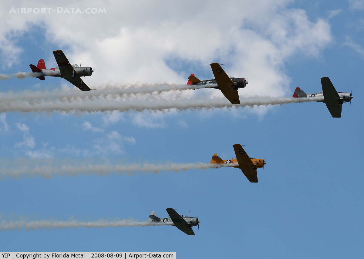 Willow Run Airport (YIP) - T-6s in formation with a single BT-13