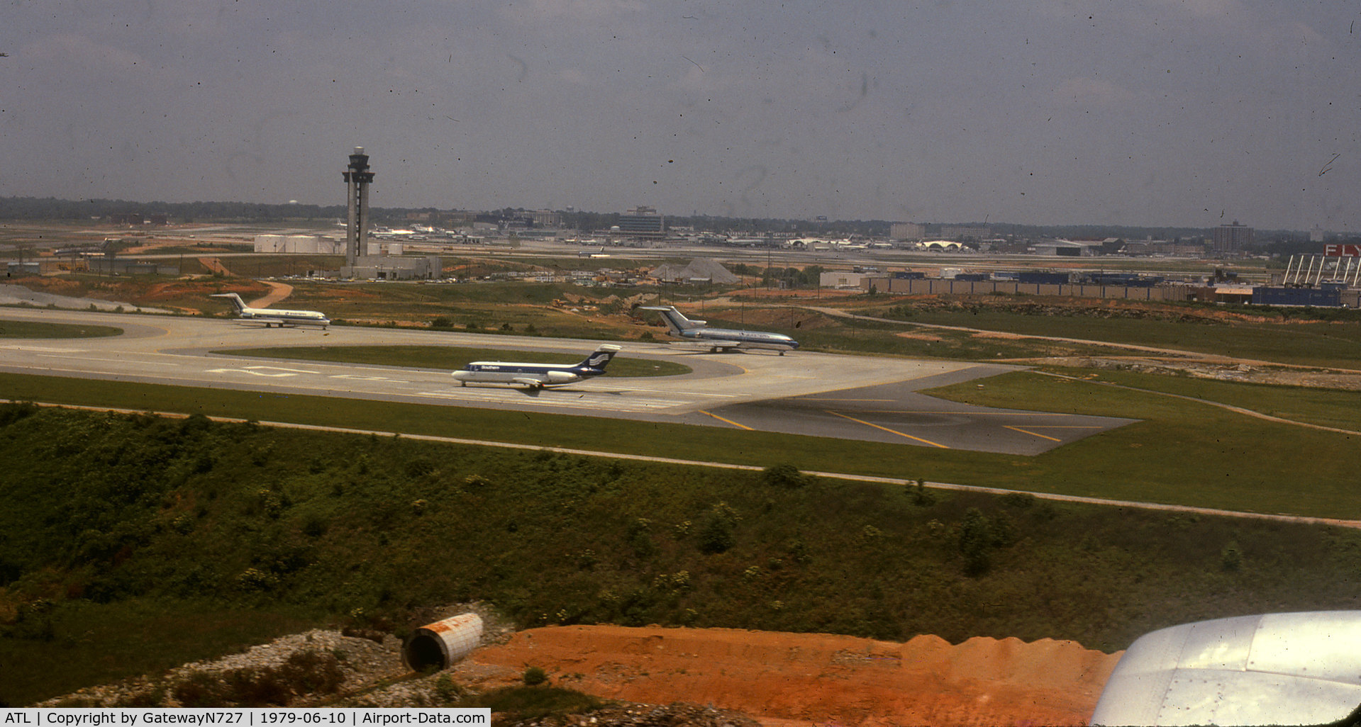 Hartsfield - Jackson Atlanta International Airport (ATL) - Short final to rwy 27L in N338EA, EAL L-1011. Note part of the 