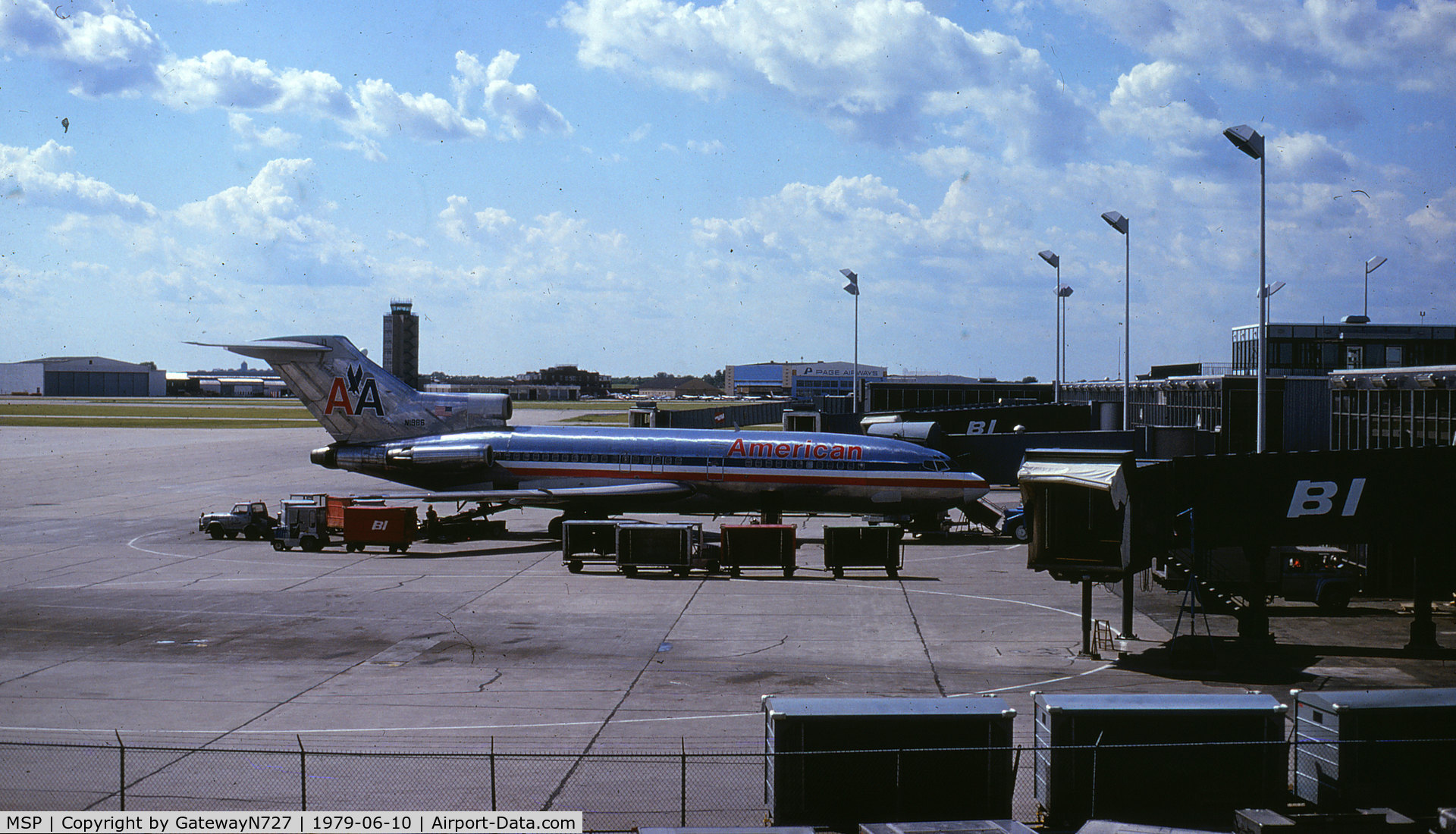Minneapolis-st Paul Intl/wold-chamberlain Airport (MSP) - Note the old Braniff International gates (BI). The building in the distance, just in front of the AA 727's #2 engine inlet, was at one time (the 1950's or so) the airline terminal. 