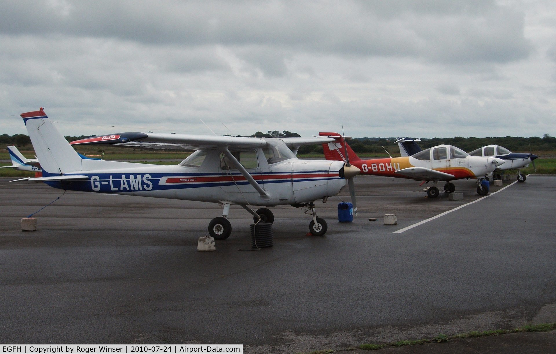 Swansea Airport, Swansea, Wales United Kingdom (EGFH) - Line up of Cambrian Flying School and Club's aircraft.