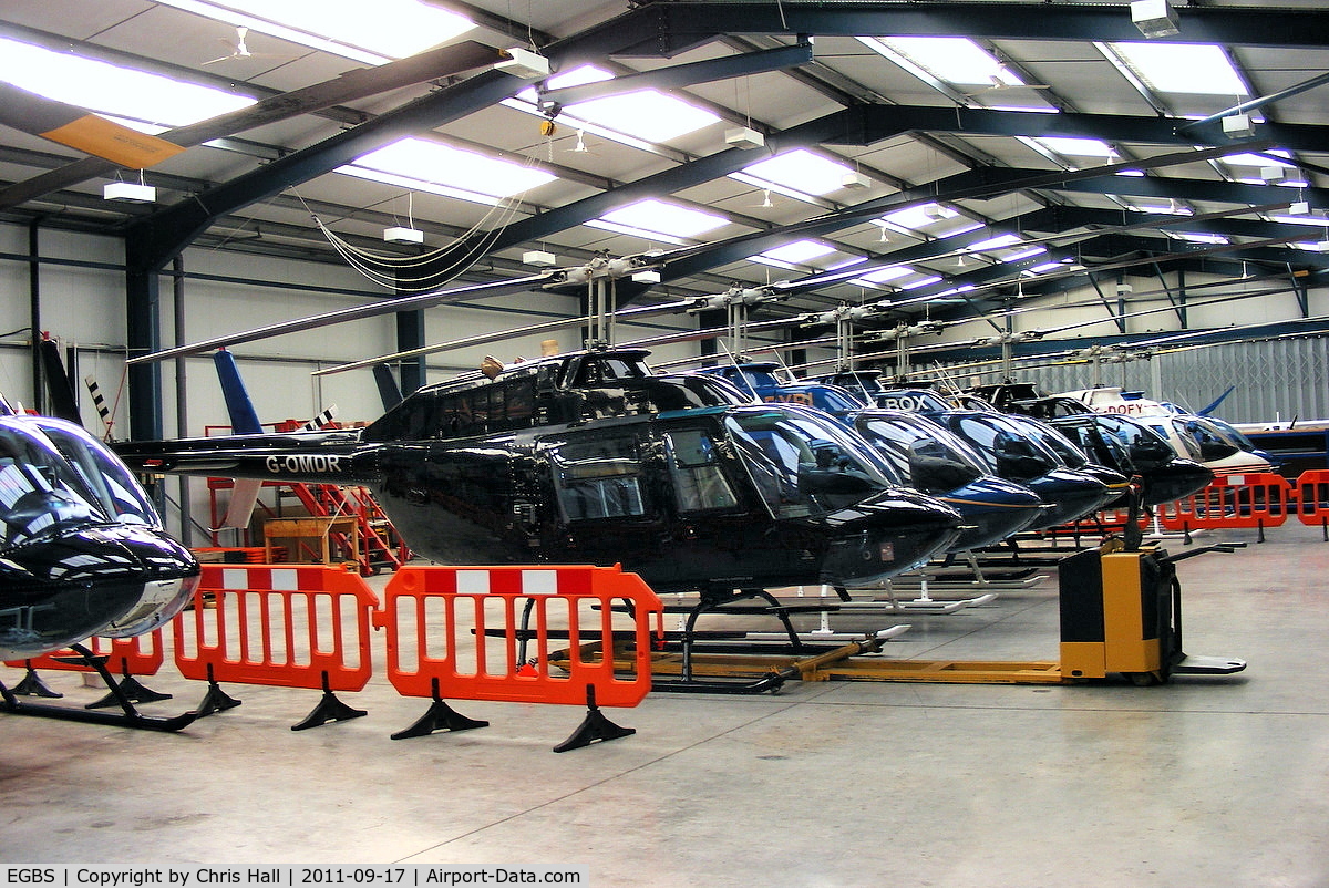 Shobdon Aerodrome Airport, Leominster, England United Kingdom (EGBS) - lineup of Bell 206 Jetrangers in the Tiger Helicopter's hangar at Shobdon