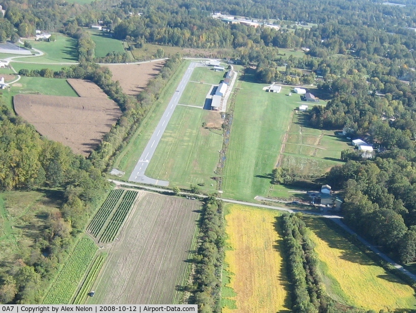Hendersonville Airport (0A7) - Looking down runways 15 ... half is paved and half is grass. The paved portion is 50' wide - there is a 50' wide grass portion of that same runway. To the right in the picture is a private, parallel grass runway on the west side of a row of hangars.