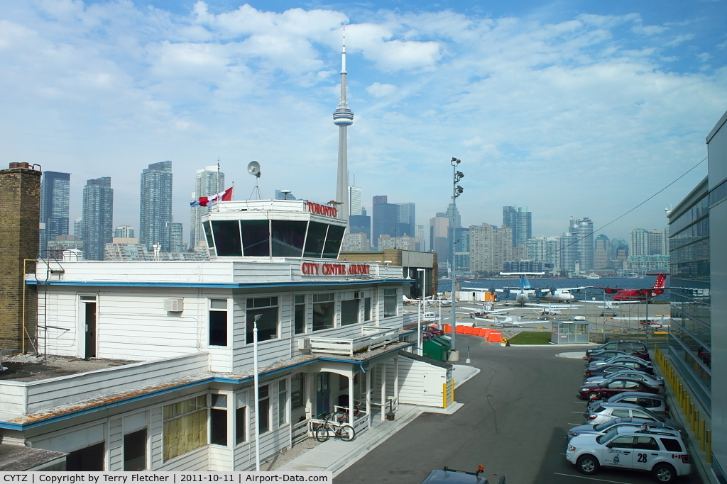 Toronto City Centre Airport, Toronto, Ontario Canada (CYTZ) - Nice to see that amongst all the new developments at Toronto City Centre Airport that the old Terminal has been retained , even if dwarfed by the new buildings