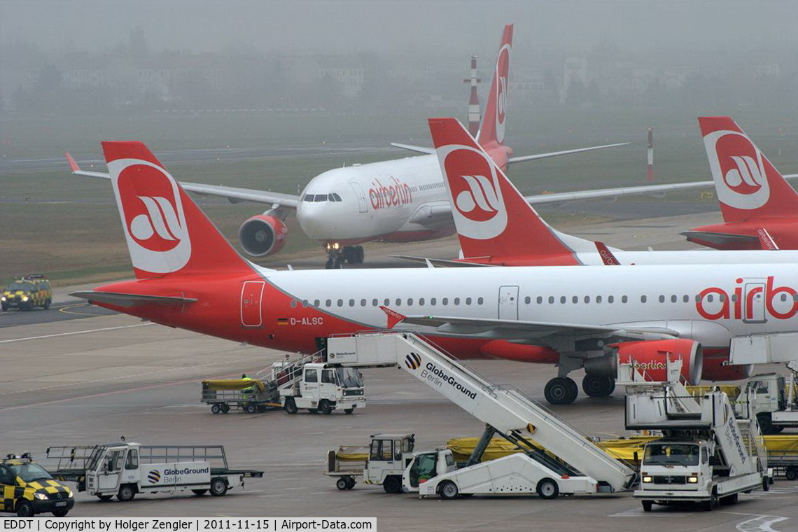 Tegel International Airport (closing in 2011), Berlin Germany (EDDT) - A big bug is crawling out of the fog.........