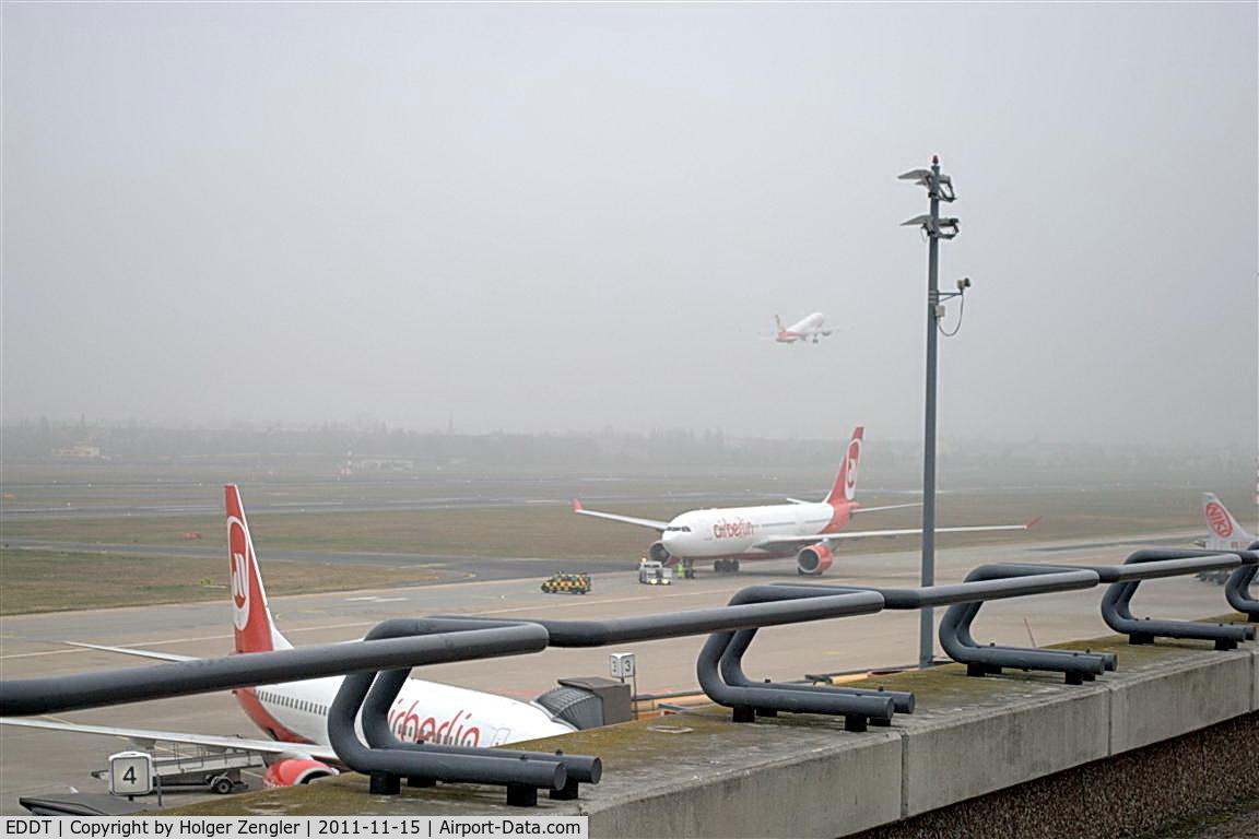Tegel International Airport (closing in 2011), Berlin Germany (EDDT) - It was a wet day and it was a cold day, but I persist on that visitors terrace to offer you this picture now!