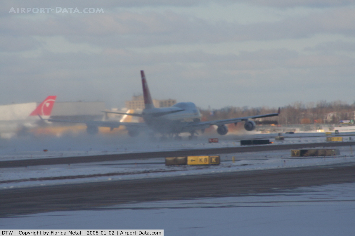 Detroit Metropolitan Wayne County Airport (DTW) - Northwest 747-400 taking off creating a blizzard
