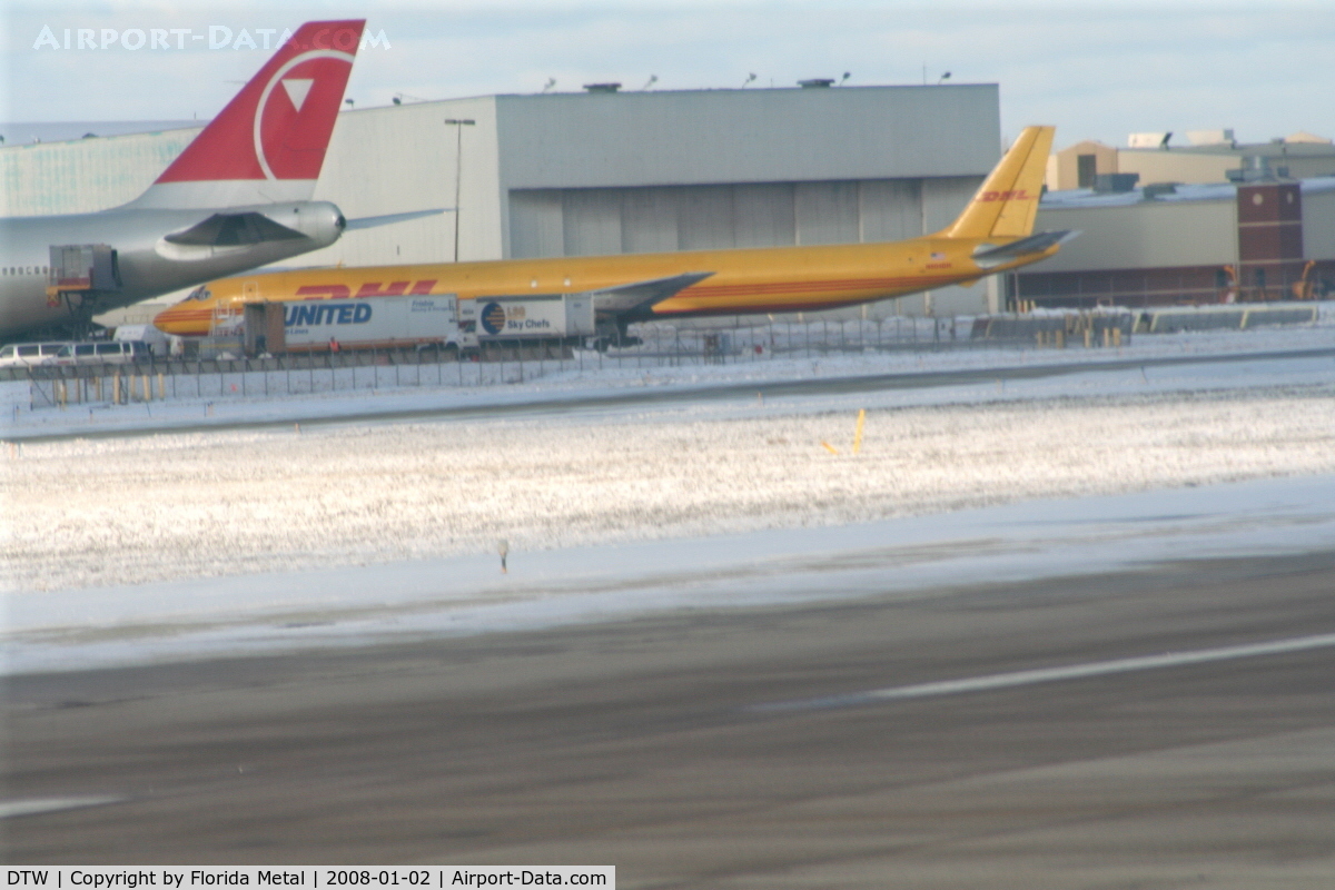 Detroit Metropolitan Wayne County Airport (DTW) - DHL DC-8-70 and tail of NWA 747-200