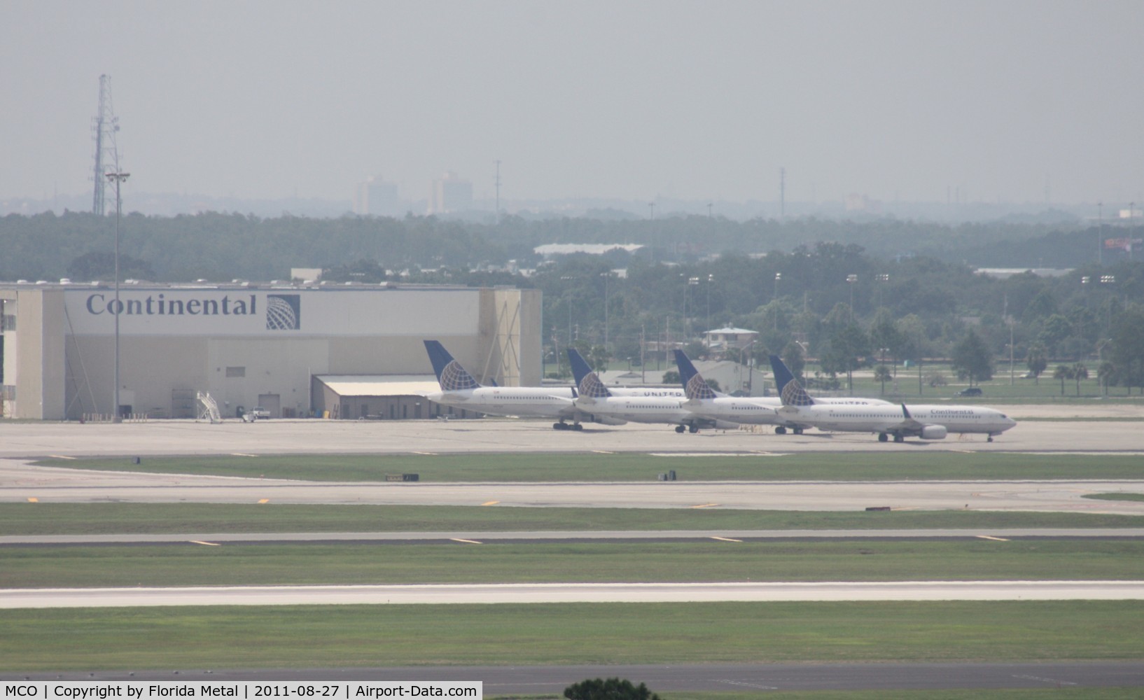 Orlando International Airport (MCO) - 4 Continental/United planes sitting at their hangar parked due to cancellations from Hurricane Irene