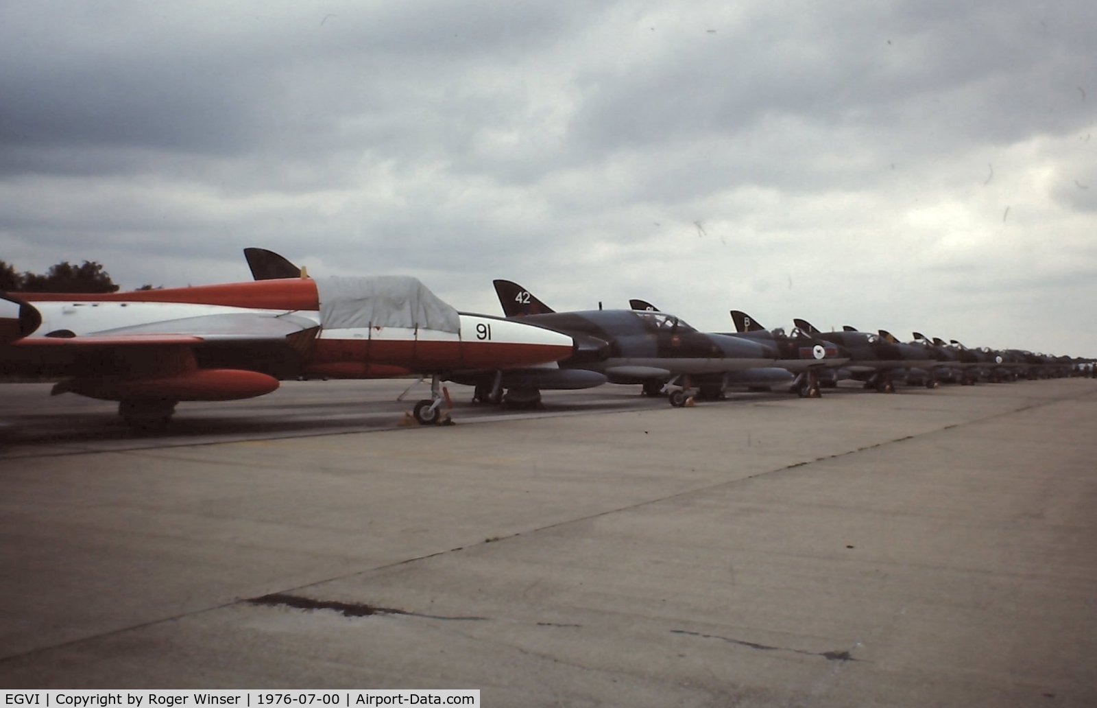 EGVI Airport - Line up of 2 seat Hawker Hunters at IAT 76 held at RAF Greenham Common in July 1976. Celebrating the 25 years since the first flight of the Hunter on 20 July 1951. 