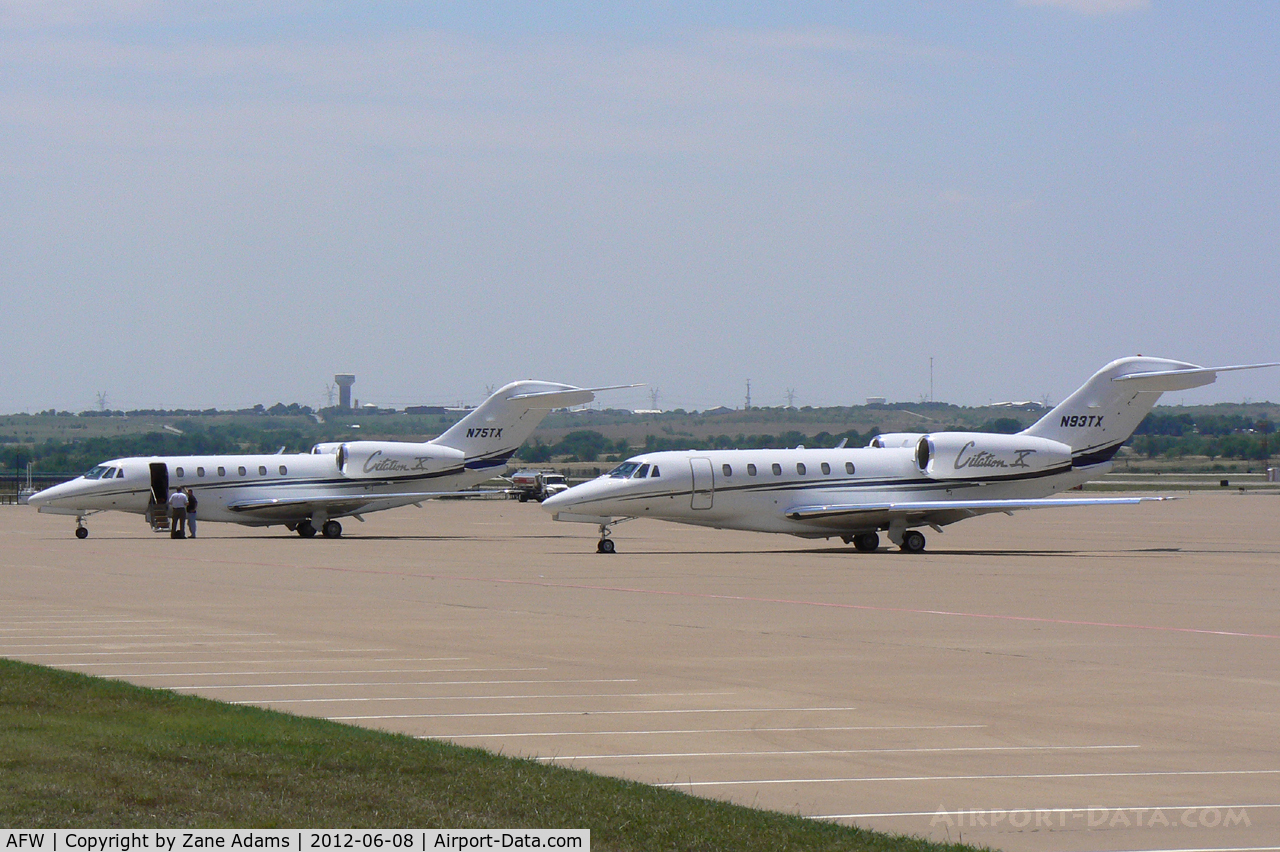 Fort Worth Alliance Airport (AFW) - Both of Textron's jets on the ramp in front of the Bell Helicopter Hanger