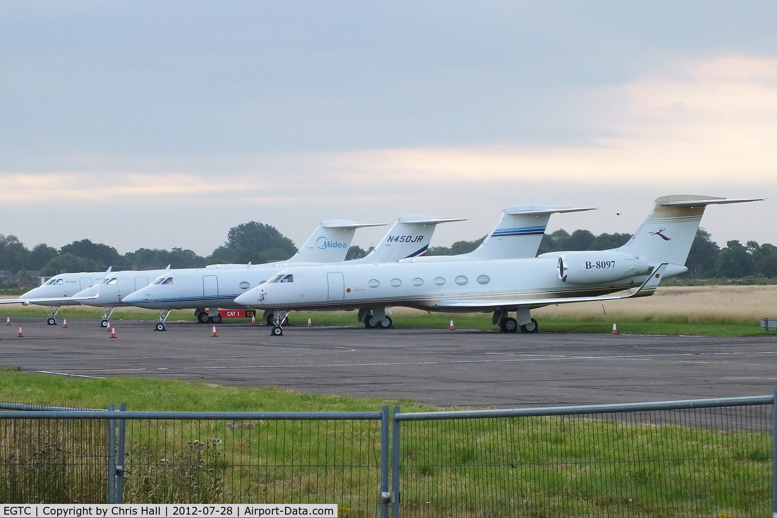 Cranfield Airport, Cranfield, England United Kingdom (EGTC) - bizjets parked at Cranfield with visitors for the opening of the London 2012 Olympic games. From L to R are B-8098, N450JR, N780W and B-8097