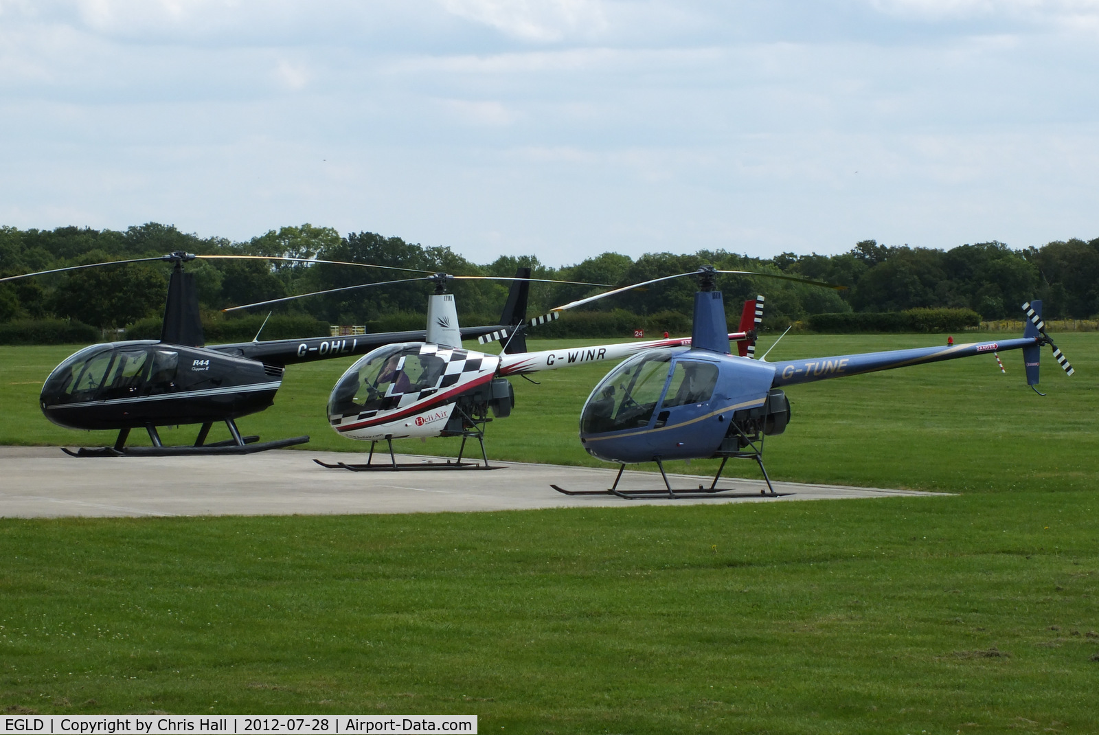 Denham Aerodrome Airport, Gerrards Cross, England United Kingdom (EGLD) - Robinson R44 and R22's outside the Heliair hangar