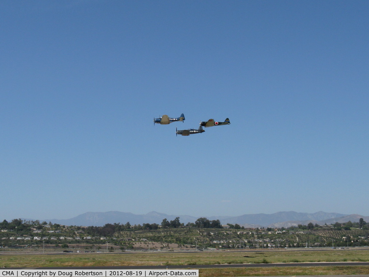 Camarillo Airport (CMA) - Douglas SBD Dauntless N670AM, Chance-Vought F4U-1 Corsair N83782 and Mitsubishi A6M Zero-Sen N712Z in formation over 26, Wings Over Camarillo Airshow 2012