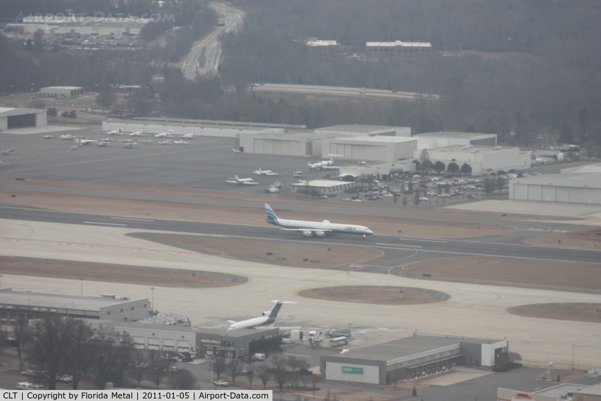Charlotte/douglas International Airport (CLT) - Further down, as we still can see the ATI DC-8 coming to a stop on the runway.  One of Jack Roush (NASCAR owner) former 727-100s sitting without engines on the ramp