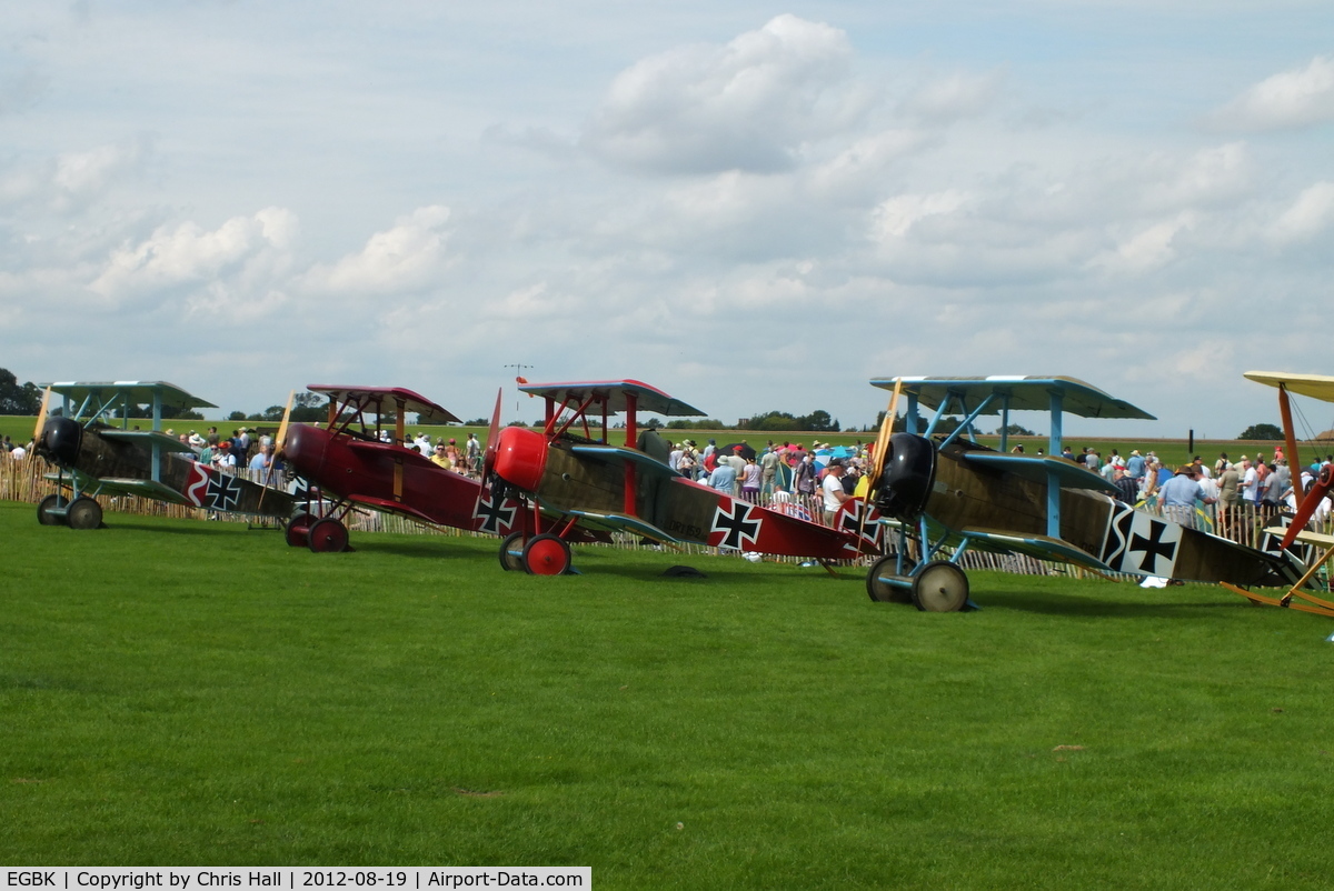 Sywell Aerodrome Airport, Northampton, England United Kingdom (EGBK) - four Fokker DR.1 replicas at the 2012 Sywell Airshow