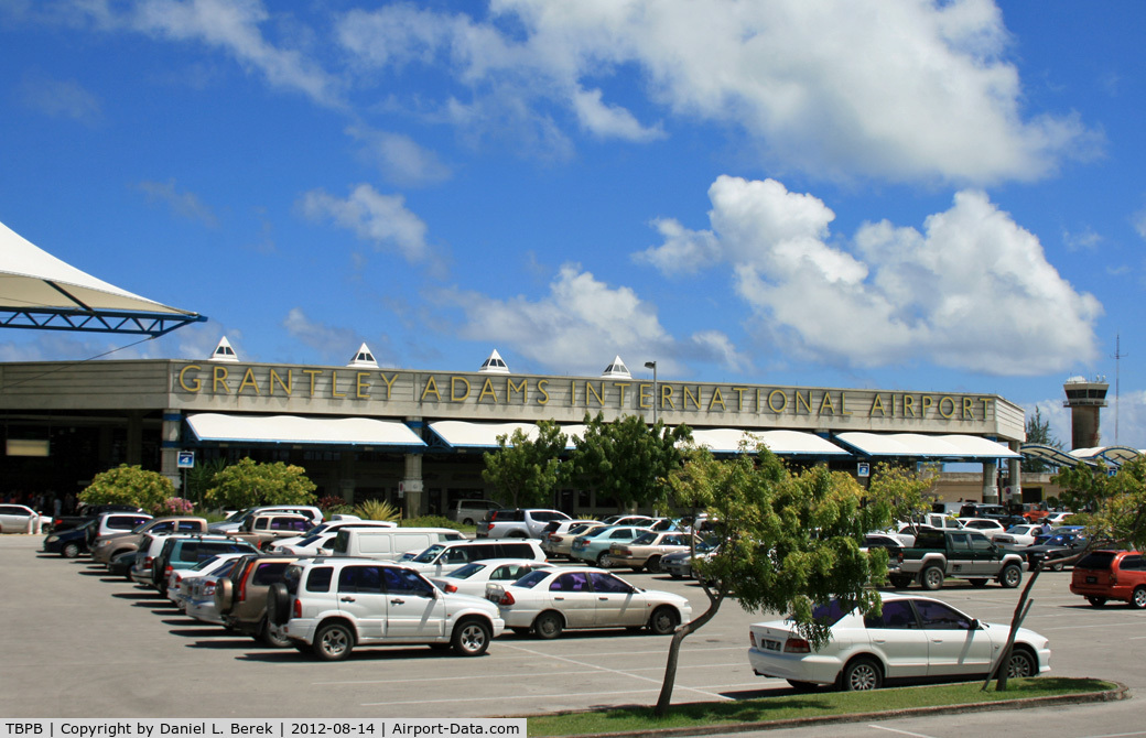 Grantley Adams International Airport, Bridgetown Barbados (TBPB) - This is the main terminal, with the control tower in the background.  For such a small island nation, this airport hosts aircraft large and small from around the world.