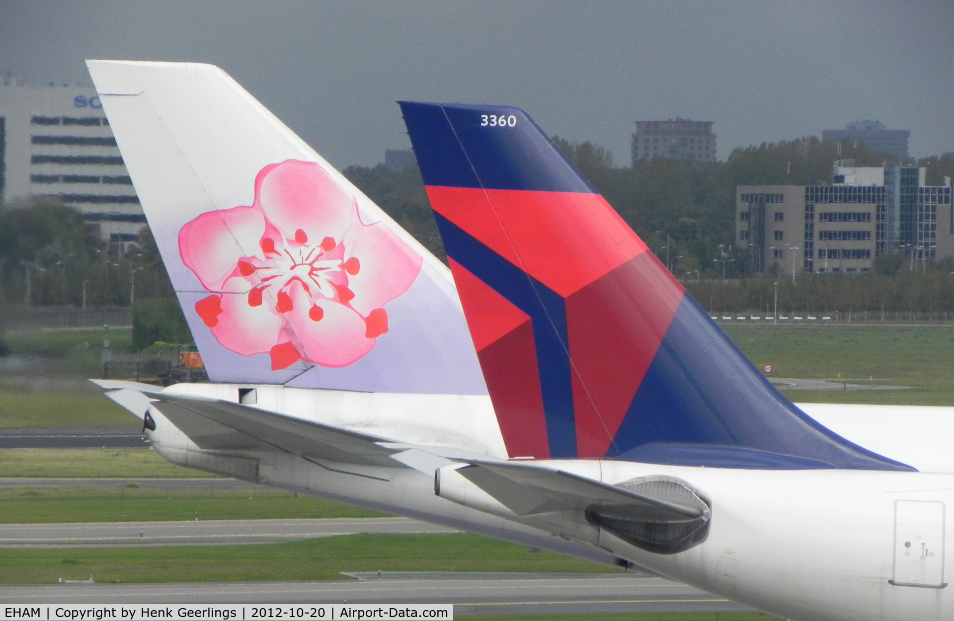 Amsterdam Schiphol Airport, Haarlemmermeer, near Amsterdam Netherlands (EHAM) - Tail from China Airlines B747 , B-18201 and Delta